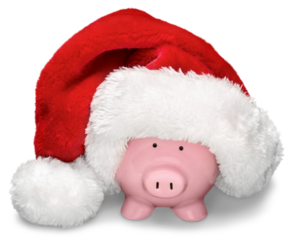 Piggy money box wearing Santa hat isolated on white