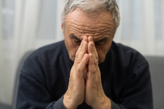 Elderly Caucasian Man With Interlocked Fingers