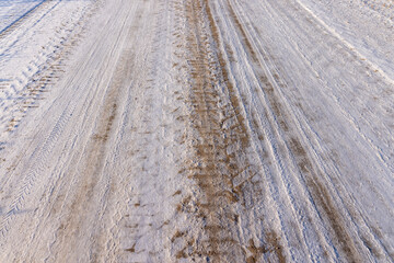 A road covered with snow and ice for cars