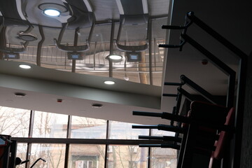 Sports equipment in the gym. Stylish sports space. Expanders and trainers with block weights. Concept: Muscle development and weight gain on simulators, body tone for the summer