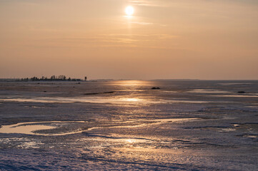 sunset over the frozen sea in winter. Kalajoki, Finland