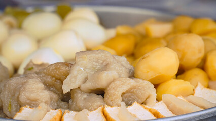 Potatoes, Tofu and Eggs steaming in a steam pot.Street food named Siomay in Indonesia