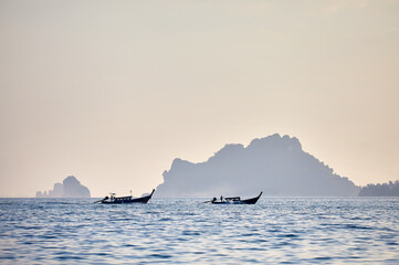 Boats in Andaman Sea near tropical island