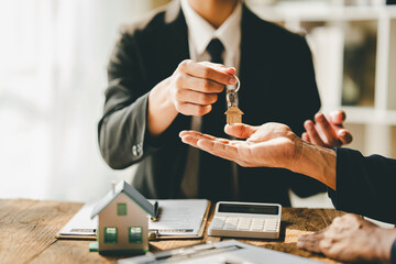 real estate agent Delivering keys and model homes to customers and home insurance contracts; home...