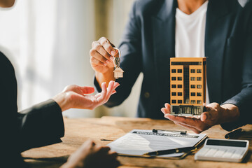 real estate agent Delivering keys and model homes to customers and home insurance contracts; home...