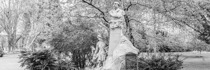 Monument to Ferdinand Fabre (1880) by Laurent Marqueste in Paris Luxembourg Gardens  in black and white - obrazy, fototapety, plakaty