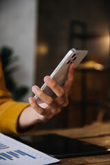 Entrepreneur Asian businessman and businesswoman discussing new business project in tablet in modern Meeting In Modern Office, Asian business casual concept.