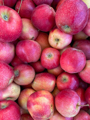fruits as a background of many ripe apples vitamins healthy nutrition