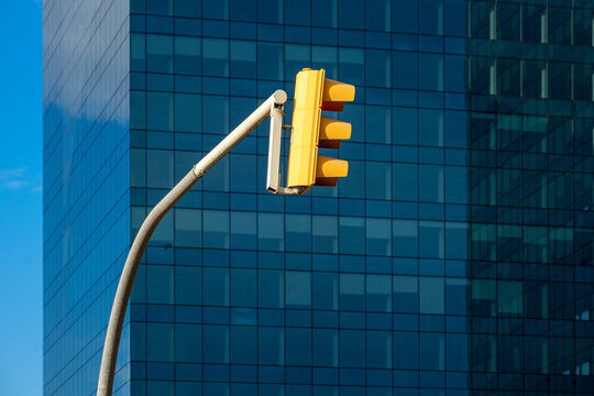 traffic light in a city in an area of modern office buildings