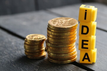 Business idea concept, inscription on yellow cubes.