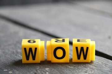 Wow concept, inscription on yellow cubes.