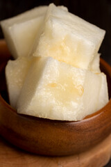 Ripe yellow melon cut into pieces and portions