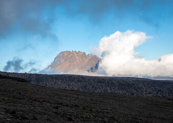 The Majestic Beauty of a Mountain standing out of a splendid Blue Sky