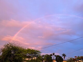 Fototapeta na wymiar rainbow over the purple sky