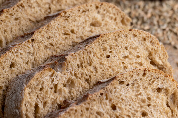 Cut into pieces fresh baked loaf of dark bread