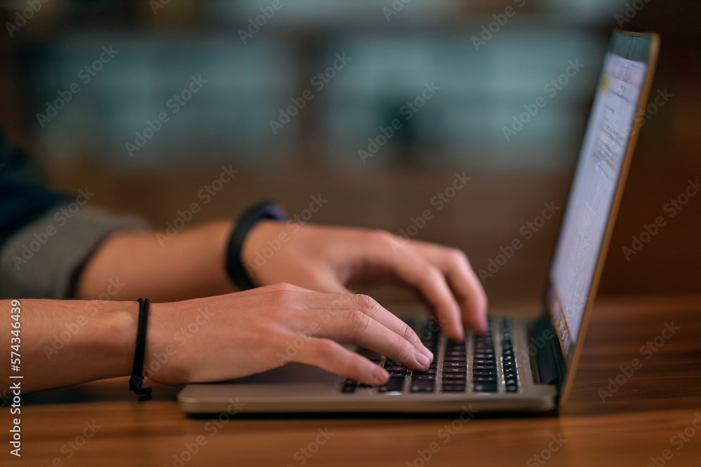 Poster unrecognizable man touching laptop computer keyboard, cropped