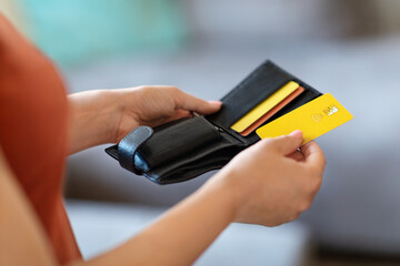 Unrecognizable Female Holding Leather Wallet And Taking Out Bank Credit Card