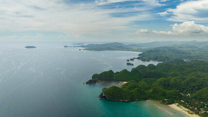The coast of the island with tropical vegetation and the beach. Negros, Philippines.