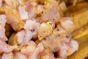 Sliced raw chicken fillet with spices