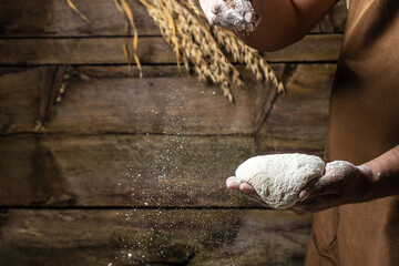 Pizza dough, men hands Cooking bread. Hands kneading raw dough. Culinary, cooking, bakery concept