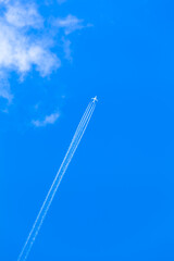 Long Journey Sky Trail / Airplane high up travel along the clouds (copy space)