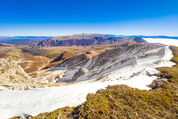 Ovindoli (Abruzzo, Italy) - The Monte della Magnola is a imponent and suggestive mountain peak in Abruzzo region, above the ski resorts of Ovindoli, here during the winter with snow and hiker.