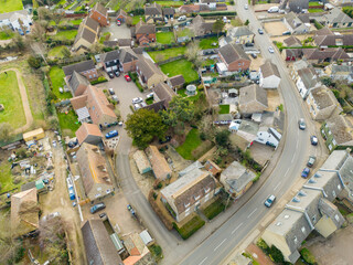 Aerial view of part of a typical English village, showing the main road snaking into the village...