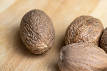 A whole nutmeg fruit on the kitchen table