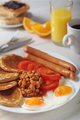 Traditional British breakfast with sausages and beans