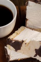 Fresh sweet cake with milk taste and aroma in chocolate glaze