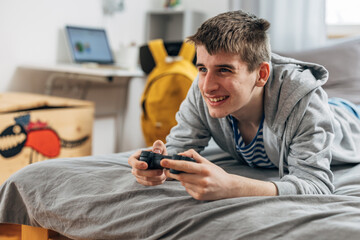 Adolescent boy enjoys playing video games