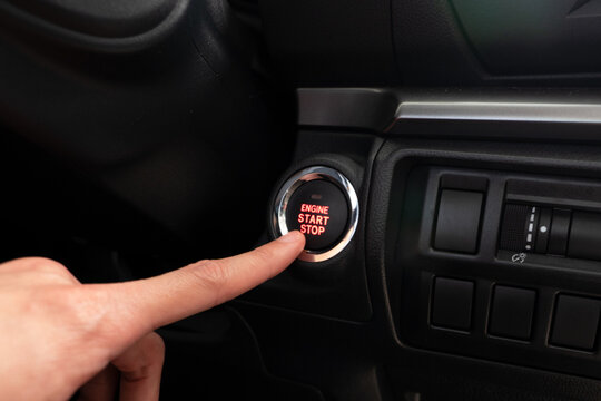 driving a car, the finger with push start button.