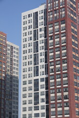 Fototapeta premium Construction site background. Hoisting cranes and new multi-storey buildings. I.ndustrial background.