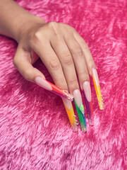 Fototapeta premium Details of gel nails on pink plush