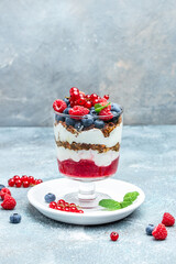 Cranachan raspberry dessert in jar on a light background. Restaurant menu, dieting, cookbook recipe top view