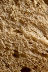 A loaf of bread made of wheat and rye flour cut into pieces