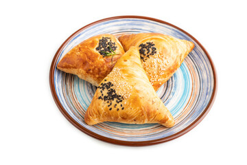 Homemade asian pastry samosa isolated on white. side view.