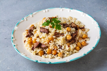 Rice pilaf with meat and chickpeas. Delicious dishes from Turkish cuisine. Turkish name; etli, nohutlu pilav.