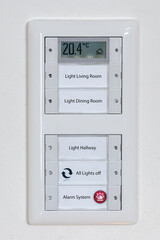 Adjust temperature in the house on a thermostat in winter in the energy crisis