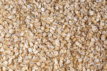 Heap of dry rolled oats isolated