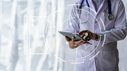Young asian male doctor in white coat holding tablet with medical health concept icons