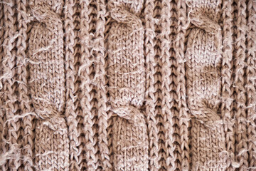 Obraz premium Light brown melange yarn fabric knitted texture. Marl wool knitting background. Up close