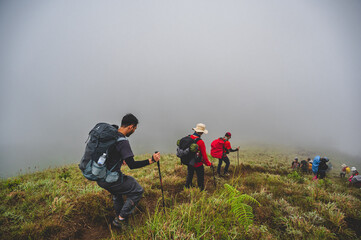 Chiangmai.thailand 20.11.2022  unacquainted people hiking on monjong mountain with Beautiful view and the mist cover the mountain.Doi Mon Jong is one of the top ten peaks in Thailand.