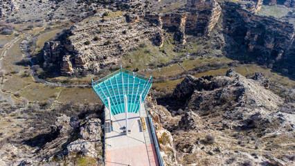 Aerial drone view of Ulubey Canyon from the glass terrace..Ulubey Canyon is the second longest canyon in the world. Ulubey, Usak, Turkey. Turkish name; Ulubey Kanyonu Cam Teras