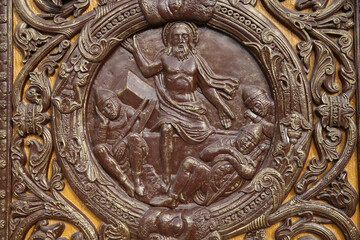 Fototapeta na wymiar Saint Denis basilica. Reliefs on the central door. Christ's resurrection. France.