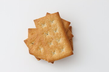 a close up of coconut biscuit with sprinkled sugar isolated on white background.