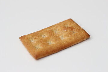 a close up of coconut biscuit with sprinkled sugar isolated on white background.

