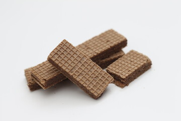 Obraz na płótnie Canvas a close up of chocolate wafers isolated on white background.
