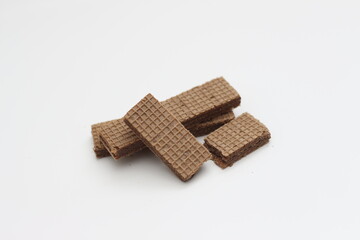 a close up of chocolate wafers isolated on white background.