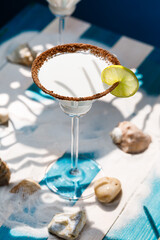Fototapeta na wymiar Key lime pie cocktail in martini glass. Martini alcoholic cocktail or non-alcoholic mocktail. Martinis.